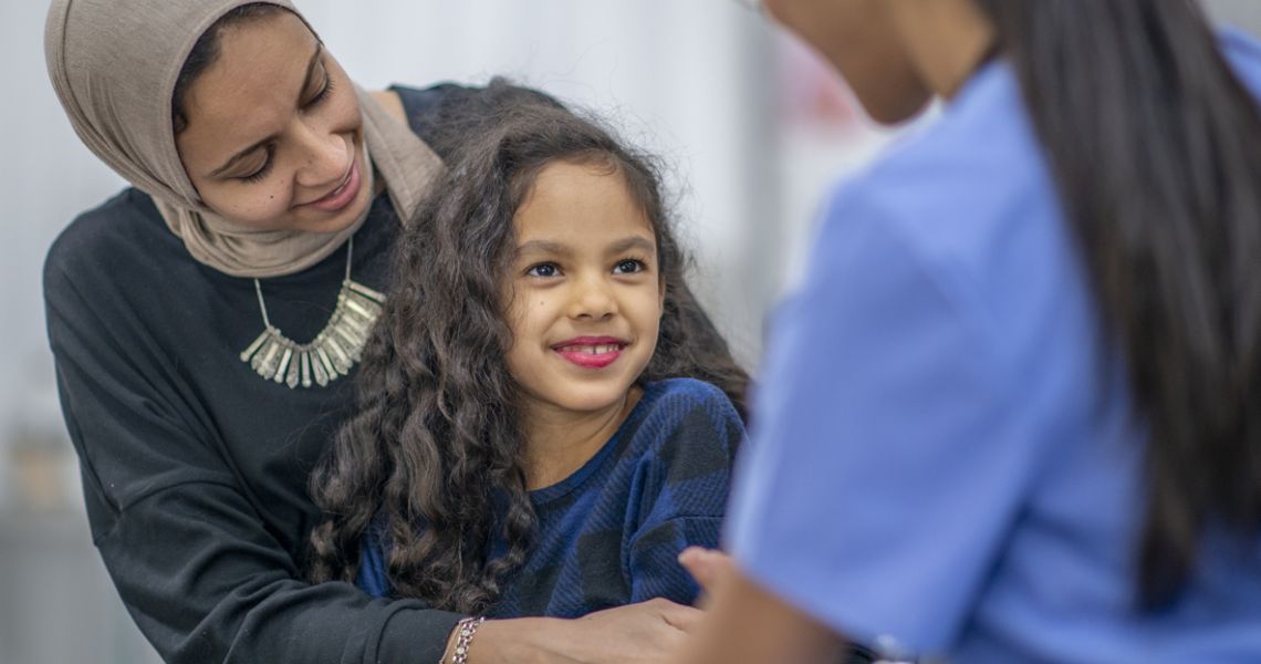 Clinician with mother and child